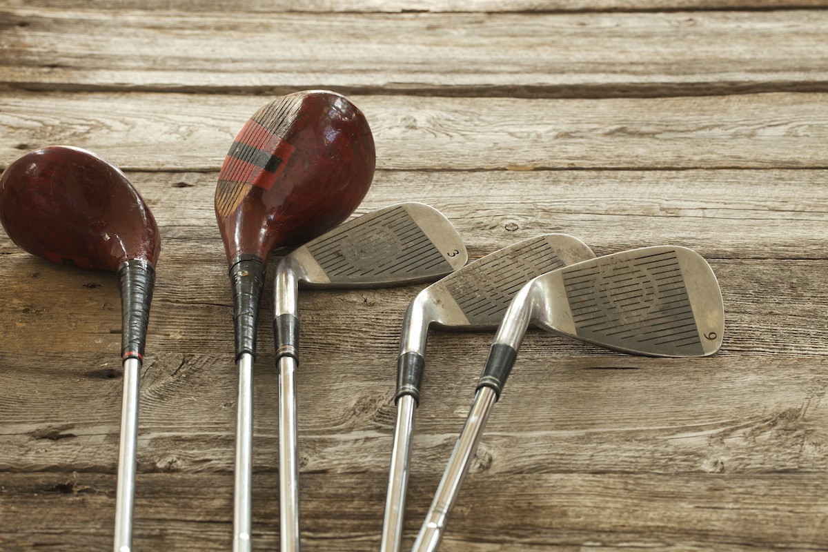 antique-golf-clubs-on-rough-wood-background-2021-08-26-18-19-19-utc