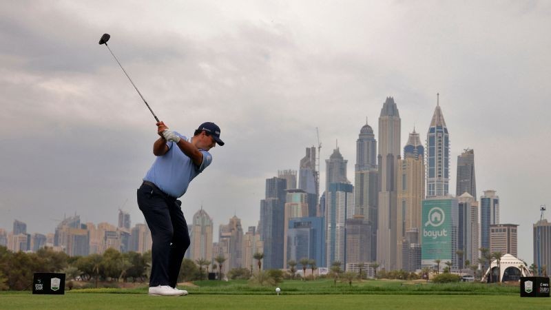 Reed leads McIlroy in wet Dubai Classic