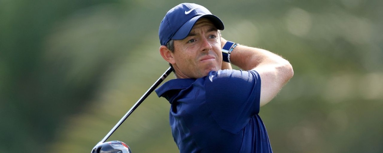 Rory, Reed tied two behind leaders in Dubai